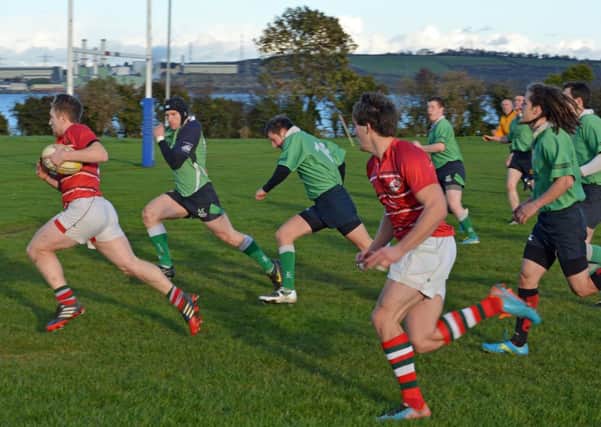 Matthew Agnew breaks through for Larne RFC II XV to score their first try in their game against  Ballynahinch. INLT 46-021-PSB