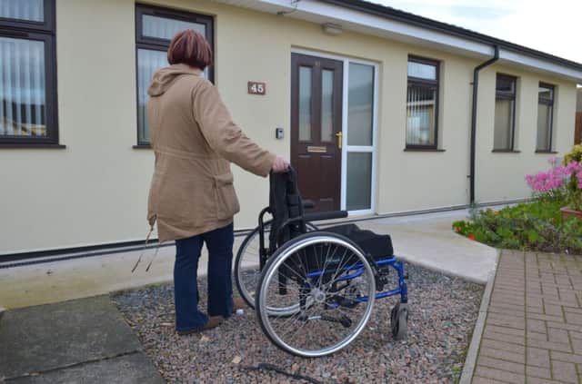 Gravel and narrow paths at the front of Ryan McCombe's home at Craigyhill Bungalows are unsuitable for wheelchair access. INLT 46-316-PR