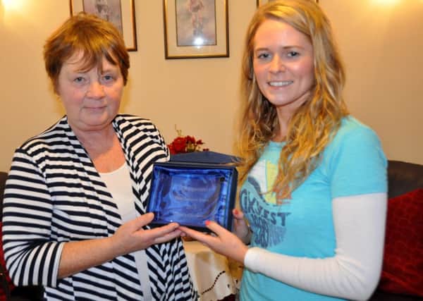 Event Organiser Beverley Pierson (right) collects the award from Marian Lamb (left) from Cycling Ulster.