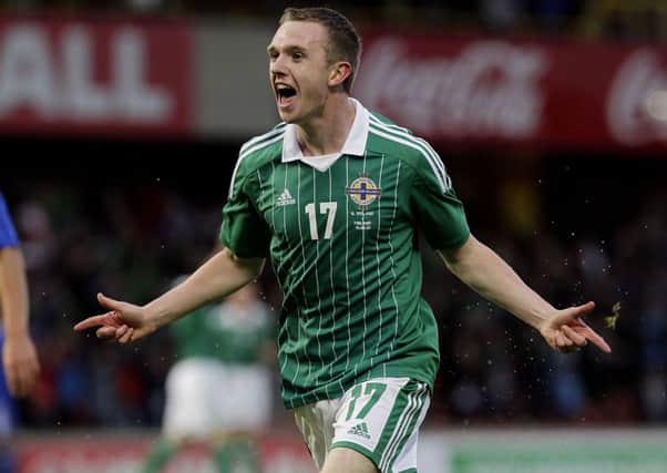 Northern Ireland's Shane Ferguson celebrates scoring against Finland last year.