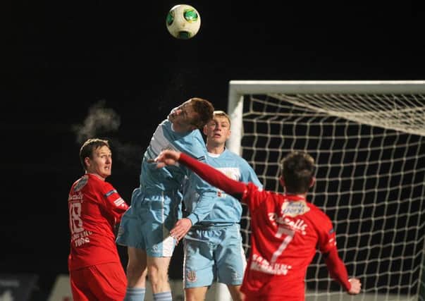 Ballymena United's Aaron Stewart clears a cross into his box during tonight's League Cup quarter-final against Portadown.