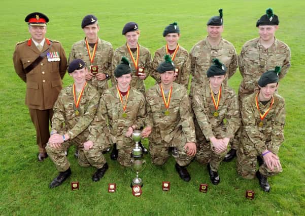 Colonel Kane joined the members of the C Company B Team from Ballymena as they celebrated winning the 2013 Tripoli Cup. The event, held annually at Magilligan Training Camp, tests the full range of Cadet skills and disciplines and is regarded as one of the toughest - and therefore most prestigious - competitions of the Cadet calendar. Pictured, back row, from left are Rory Glass; Robin Moore; Cameron Waring with Adult Instructors Gary Minnis and Jonathan Stevenson.  Front row, from left, are Richard McCully; Arran George; Ryan Brewster and Ryan Craig.