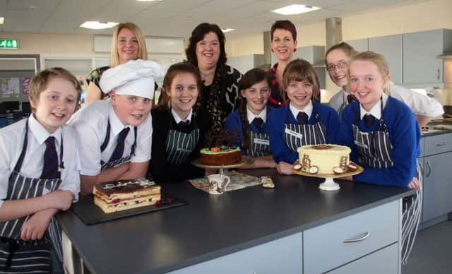 Students from Dalriada School who made the final of a competition to find the best baked cake at the official opening of the new Domestic Science department. Included are Alice McMullan, Kate Beattie, Josh Watson, Lydia Walsh, Peter Smith, Cait Kirkpatrick and Emma Chestnutt. Also pictured are teachers Dawn Huey and assumpta McGonigle along with celebrity chef, Paula McIntyre.INBM47-13 106F