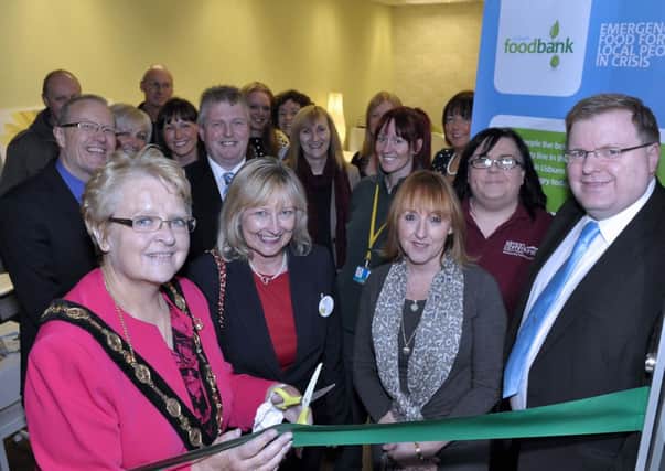 At the official opening of the new food bank in Kingdom Life City Church are Lisburn Mayor Margaret Tolerton with invited guests and volunteers US4013-404PM Pic by Paul Murphy