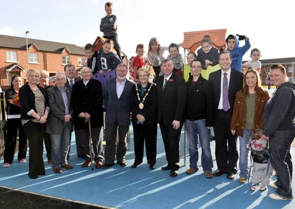 At the official opening of the Ballymacoss Hill Play Park are Mr Tony Kennedy, OBE, Chairman of Ulidia Housing Association; The Mayor of Lisburn, Councillor Margaret Tolerton; Chairman of the Councils Leisure Services Committee, Alderman Paul Porter, local MLAs, and residents from the area.