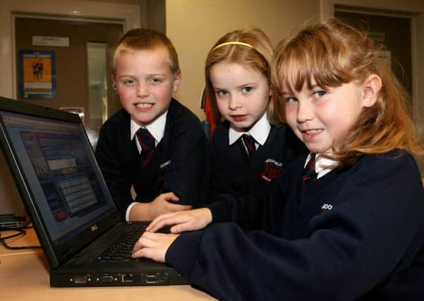 Moorfields PS pupils Matthew McConnell, Lucy McLeister and Rachel Wylie working on the school laptops. INBT47-205AC