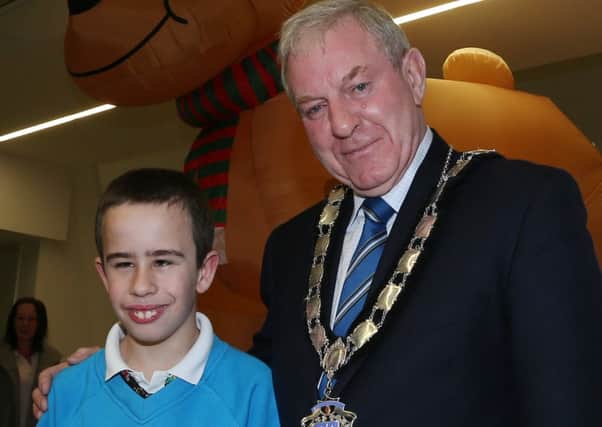 Deputy Mayor of Ballymena Cllr James McClean with Castle Towers pupil Calum Bamford who switched on the Ballymena Christmas lights last Tuesday evening. INBT 47-101JC