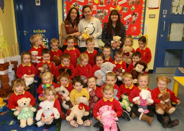 Children from Ballykeel Nursery Unit with their teddy bears raising money for Children in Need. Included are Mrs. Cara Richmond (classroom assistant), Jamie Gilliespie (student) and Mrs. Dawn Ritchie (teacher). INBT47-206AC