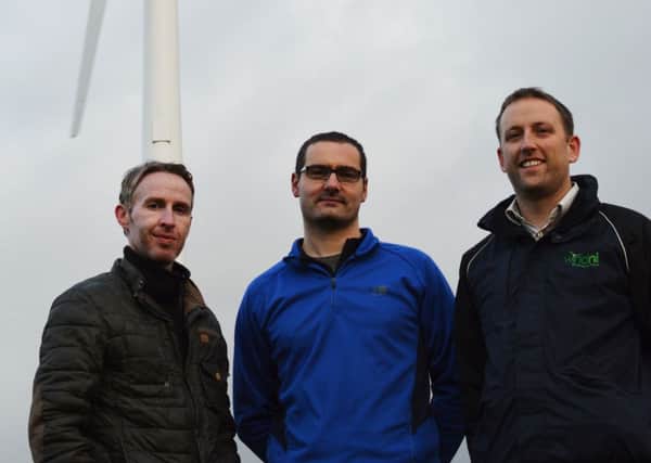 Colm McClean (left) and Jonny Barr (right) of Wind NI with Ballycarry landowner  Ian Milliken.  INLT 47-676-CON