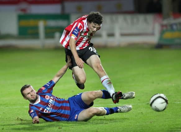 Derry City's Barry McNamee jumps over St Patrick's Athletic's winger Conan Byrne.