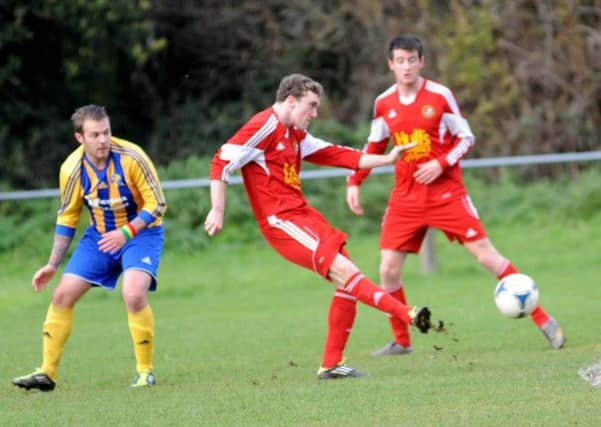Barry Simpson attempts to find a team-mate during Carniny Amateurs' Crawford Cup win over Woodlands at the weekend.