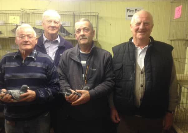 Ballymena class winners George Eagleson (l) and Dennis Craig with judges Albert & Tom Young.