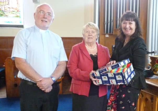 Rev Dr Stewart Jones and Sally Robinson with Sharon Jack from Operation Christmas Child