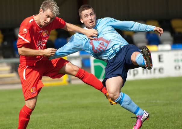 Institute's Robbie Hume (right) scored their first goal against Harland & Wolff Welders, on Saturday.