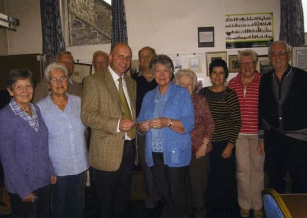 Invermore Arts Society present a cheque for £400 to Brendan McAfee of Roddensvale School. The money was proceeds from the September Art Exhibition ballot and catalogue sale held in the Dixon Hall, Drains Bay. INLT 45-807-CON