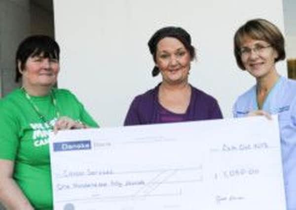 Pictured from left to right is Bernie McLaughlin, Macmillan Benefits, Western Trust; Grace Farren and Michelle Doherty, Lung Nurse Specialist, Sperrin Suite, Western Trust.