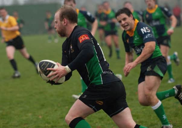 City of Derry's William McCleery makes an attacking run during Saturday's match against Ballynahinch. INLS4713-181KM