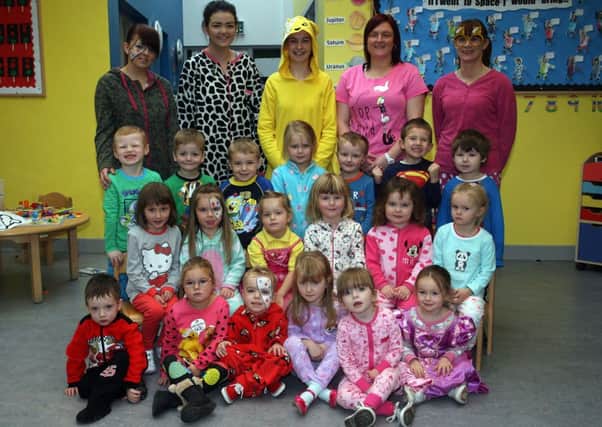 Children from the Ballee Pre-School Playgroup, along with staff, who dressed in the pyjamas raising money for Children In Need. INBT47-227AC
