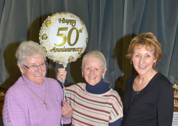 Founder members of Craigyhill Methodist Girls' Brigade Maureen Turner and Kay Aiken pictured at the 50th anniversary party with captain Lynne Milligan. INLT 47-372-PR