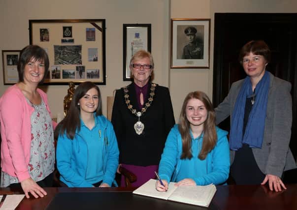 Karlene Crawford (left) and Leah Wright of 1st Ballymena Girls Brigade who are traveling to South Africa as part of GB Conference and Mission Trip were guests of Mayor of Ballymena Cllr Audrey Wales at a reception in the Mayor's Parlour. The girls were accompanied by their mums Karen Crawford and Anne Wright. INBT 48-102JC