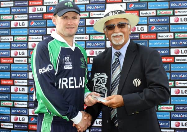 William Porterfield receives the MOM award from Dev Govindjee following his unbeaten 127 against the USA as Ireland won by 75 runs.