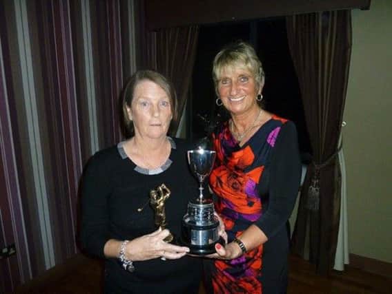 Thelma Smyth receiving the Maureen Henry Cup fo golfer of the year.