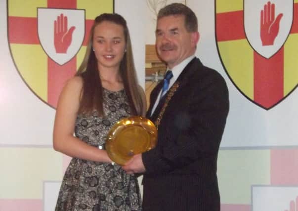 Kerry McDowell receives her award.