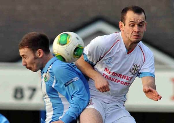 Ballymena United's Tony Kane challenges Warrenpoint Town's Marty Havern during today's Premiership match at Stangmore Park. Picture: Press Eye.