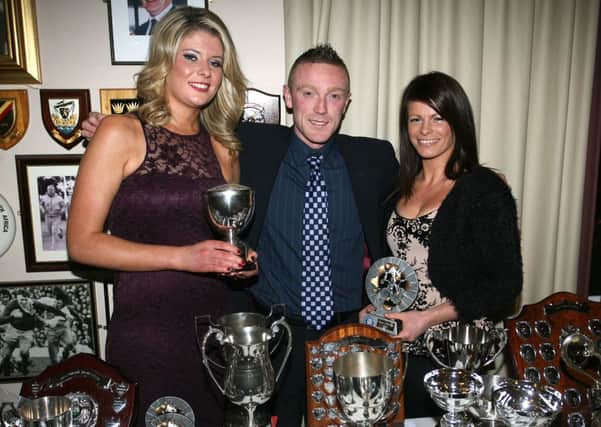 Eileen Burns (winner) and Claire Gillespie (runner up), prize winners from the ladies section, are pictured with guest speaker Ryan Connor at the Ballymena Road Club annual dinner. INBT48-251AC