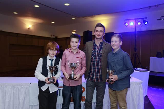 Coleraine's Sam McDonnell centre left Tom Edgar and Jack Irvine receiving their UKC awards from Colin Turkington.