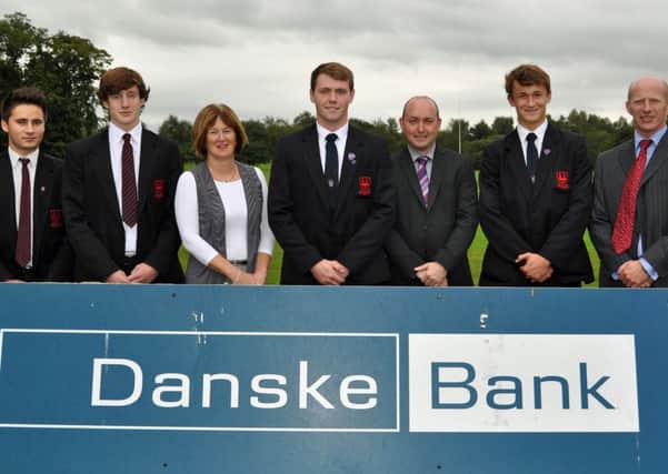 Danske Bank officials Mrs Carol Wilson (Senior Manager) and Mr Alan Murdock (Business Relationship Manager) presents sponsorship to Ballymena Academy First XV captain Duncan Maguire. Also included are E Kosch, J McKeown,  J Jolly and Mr Alistair McKay.