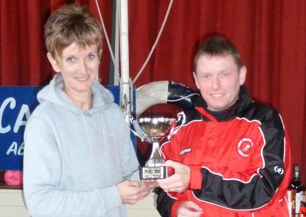 Winner of the Larne AC Coast Road handicap race Janine Rainey with club chairman Andy Gregg. INLT 48-904-CON