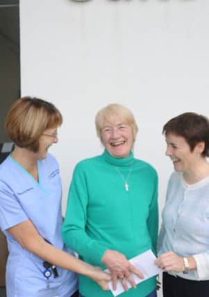 Pictured left to right, are: Michelle Doherty, Western Trust Lung Cancer Nurse Specialist; Madeleine Coyle, (presenting the cheque on behalf of her mother, Mrs Canning) and Rose Sharkey, Western Trust Respiratory Consultant.