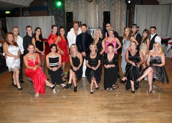 Event organiser Elaine McKee with the judges and competitors at the Strictly Come Dancing charity fundraiser held at Nortel Social Club in aid of the Liver Support Group at the Royal Victoria Hospital. INNT 46-087-FP