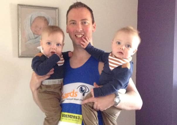 Stuart Bratton, pictured with his twin boys Noah (left) and Max, who celebrate their first birthday next week.
