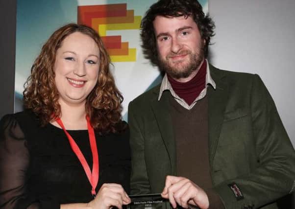 Eavan King, Foyle Film Festival Competition Manger presenting the Light in Motion (LIM) award for Best Irish Short Film to Northern Ireland-born director and writer, Stephen Fingleton.