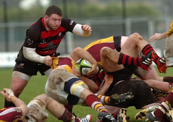 TURN OVER... Rainey try to turn the ball over during last Saturday's AIL clash with Bruff.INMM4513-350SR