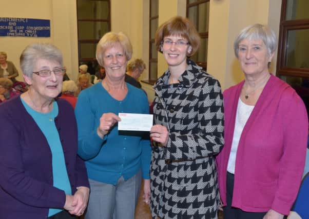 Alison Russell (second right) of Thornfield House Special School receives a cheque for £610 raised by Ballycarry Women's Institute. Presenting are fundraiser Maureen Morrow, treasurer Isabel Robinson and President Leta Marsden. INLT 46-362-PR