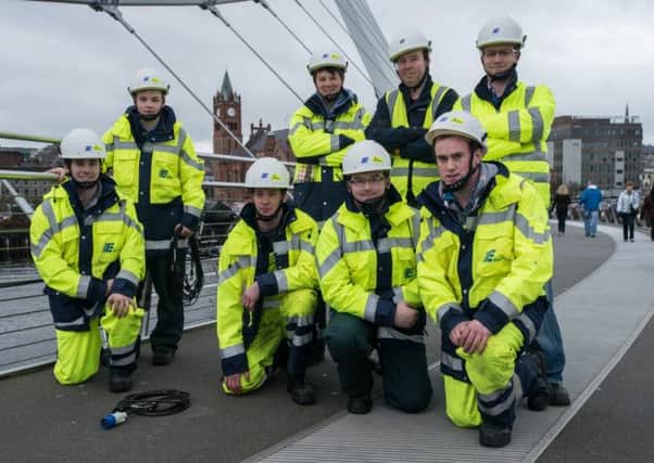 NIE apprentices who worked on the Lumiere installation at the Peace Bridge. Photo: Martin McKeown