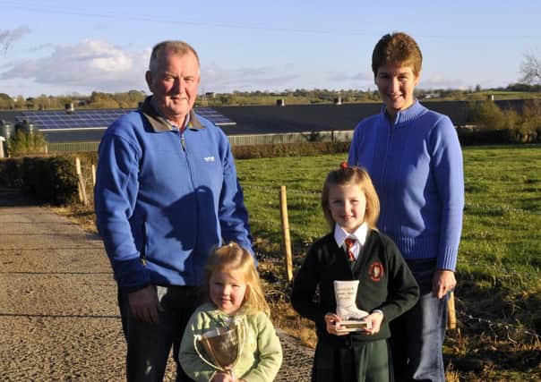 Roy and Joan Cunningham and grandchildren Grace and Abbie Forde with their Farming Life Poultry award. INPT45-109gc