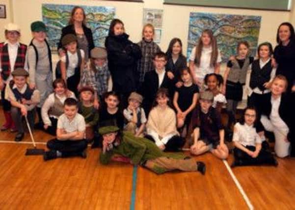 CAST OFF. Pictured are pupils from St Patrick's PS Portrush, who will take to the stage this Saturday (December 7th, 8pm) at the Riverside Theatre with their production of 'Oliver'. Included along with Teacher and Producer Natasha Calum is Principal Bibana McCavera.CR49-116SC.