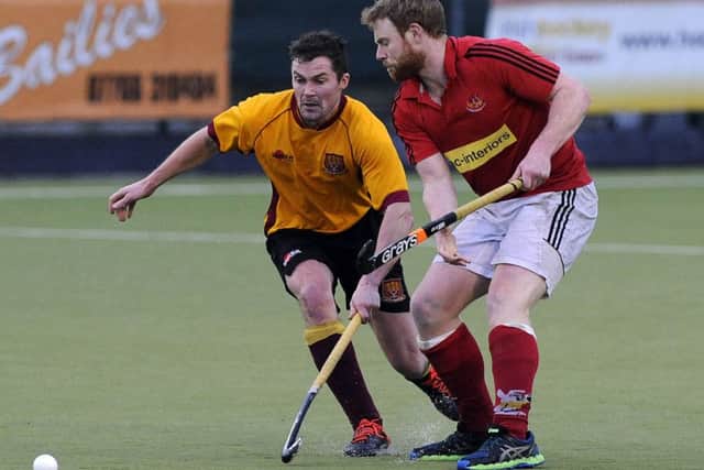 Mossley's Andrew Morrison tries to regain possession against a well-organised Corinthians team.