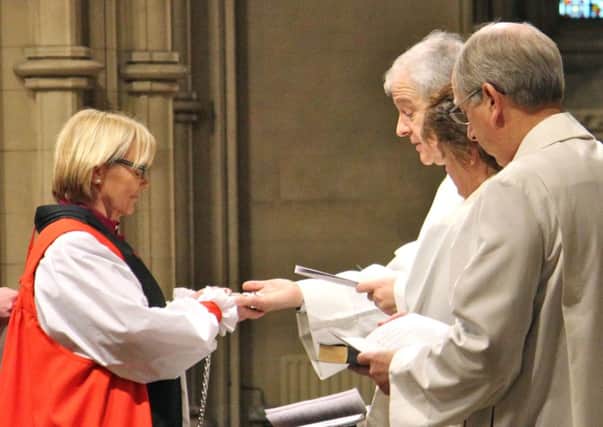 Newly ordained Bishop of Meath and Kildare, the Most Revd Patricia Storey (left), being presented with her Pectoral Cross by the Archbishop of Dublin, the Most Revd Dr Michael Jackson during the Service of Consecration in Christ Church Cathedral, Dublin. PRESS ASSOCIATION