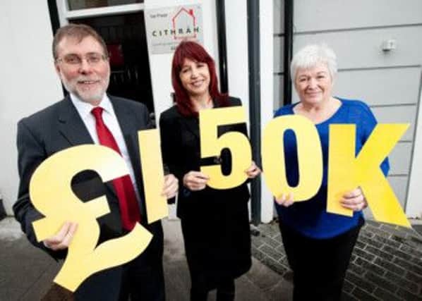 Pictured with Minister Nelson McCausland  are Margaret Henry, deputy director of Council for the Homeless and Catherine Harper, Board member at the CITHRAH Foundation.  INCT 49-723-CON