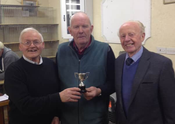 Len Russell Best in Show at Cullybackey with judges George Eagleson (l) and Billy Smyth (r).