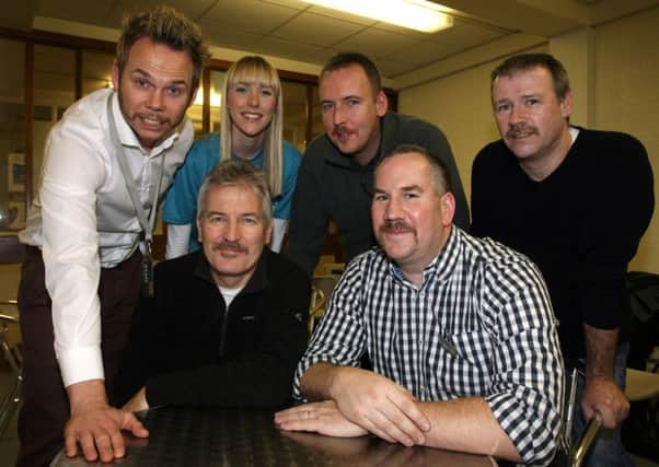 Maeve Colgan of Cancer Focus is pictured with NRC staff Kyle Leckie, Brian Lions, Nick Todd, Ian Nash and Stephen McCartney who grew moustaches for "Movember" raising money for the charity. INBT49-206AC