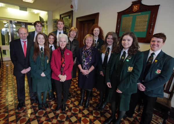 Holocaust survivor Eva Clarke is pictured with students, teachers and Mr David Mitchell, Lisburn City Council's Good Relations Officer, who attended the recent event at Friends School.