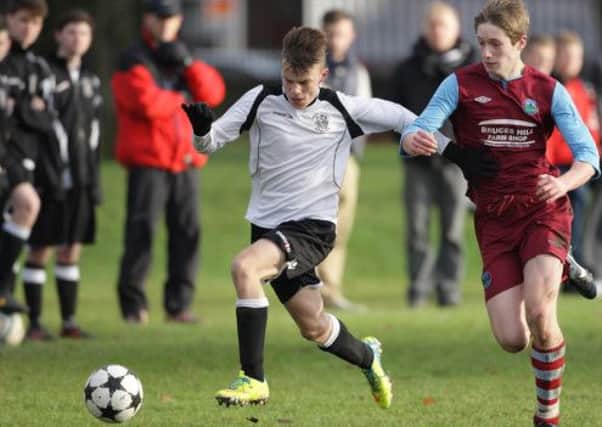 Youth soccer action from the under-16 game between Lisburn Distillery and Greenisland, at Wallace Park. US1349-509cd