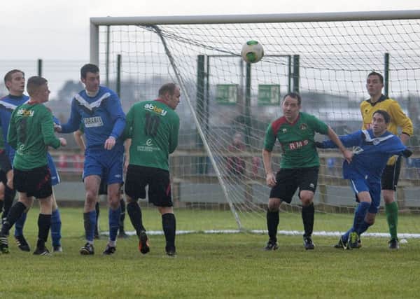 Goalmouth action during Saturday's match where Ballymoney United took on the PSNI.INBM49-13 207JC