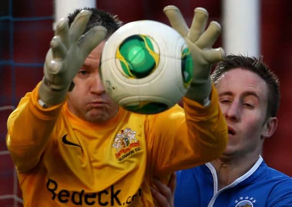 My ball... Glenavon's John Connelly gets to the ball ahead of Michael Carvill.